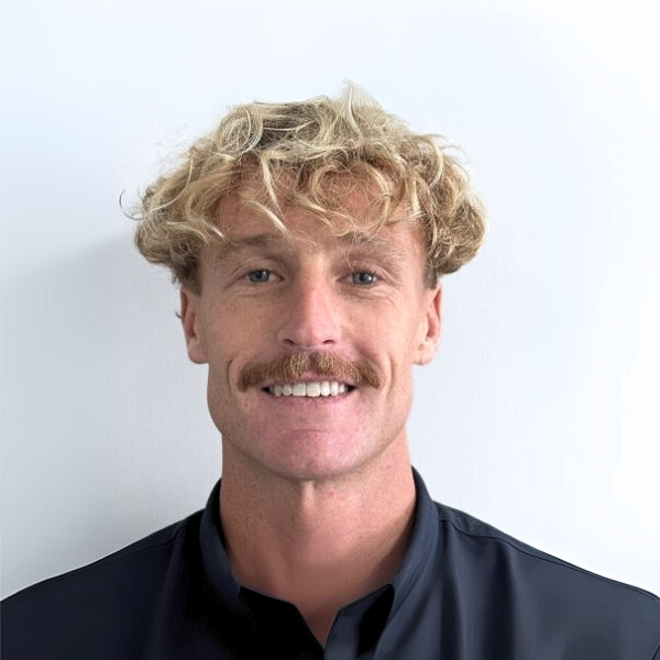 David Pearce, Consulting Psychologist at Mind-Care Mental Health Services, wearing a dark collared shirt against a plain white background.